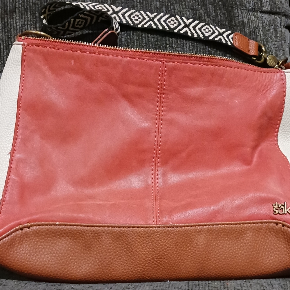 The Sak. Leather purse burnt orange and white with brown bottom